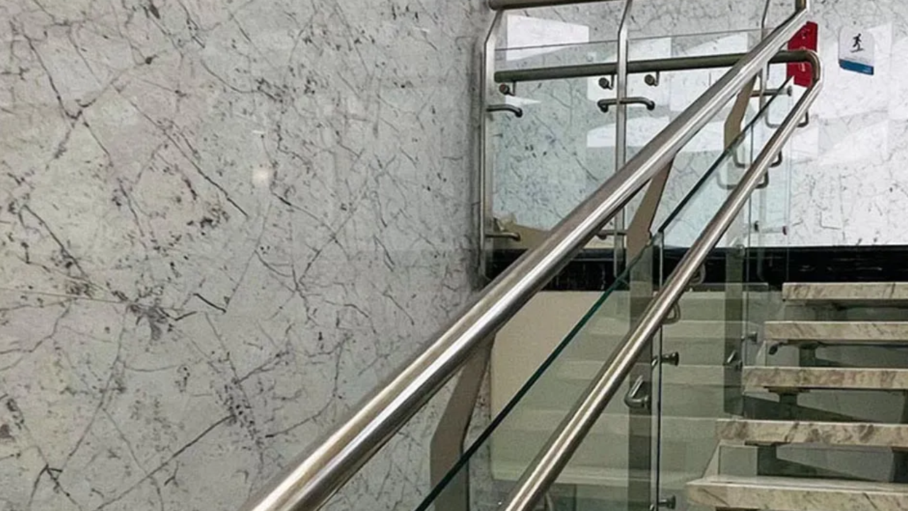 What are the chosen elements for the Glass Railing Design for the Balcony?